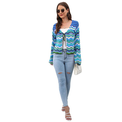 Rainbow Cadigan Christmas sweater showcasing festive colors and cozy holiday style for the winter season.