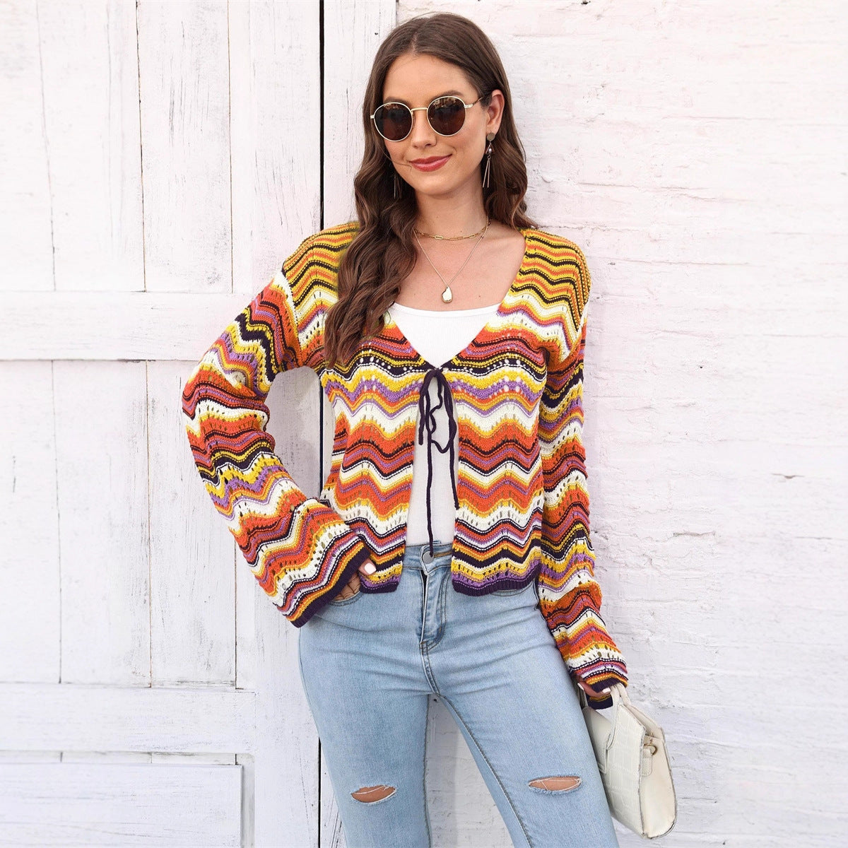 Rainbow Cadigan Christmas sweater showcasing festive colors and cozy holiday style for the winter season.