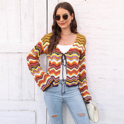 Rainbow Cadigan Christmas sweater showcasing festive colors and cozy holiday style for the winter season.