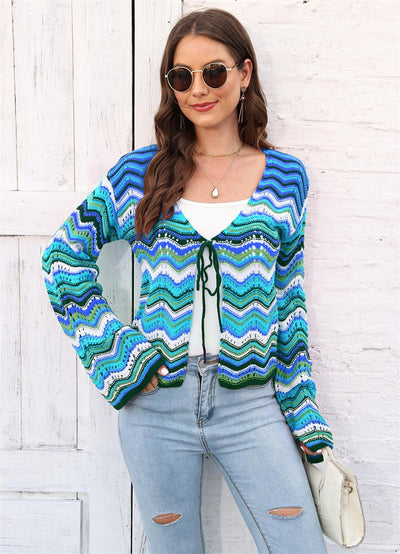 Rainbow Cadigan Christmas sweater showcasing festive colors and cozy holiday style for the winter season.