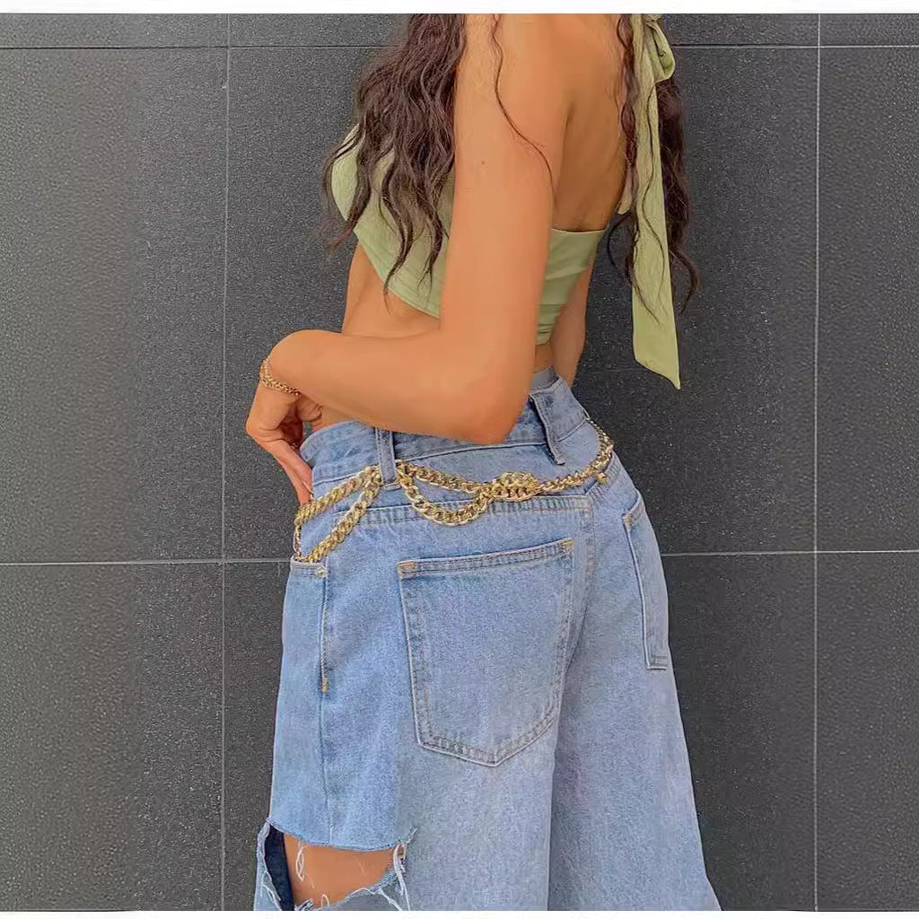 Stylish low waist jeans featuring loose hole design for a trendy and comfortable look